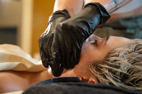 Photograph of a client receiving intra-oral massage similar to the Eleva method.